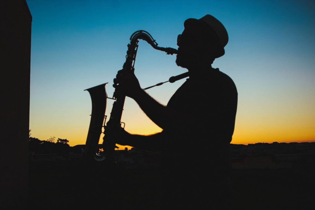 Silhouette of a saxophone player at sunset